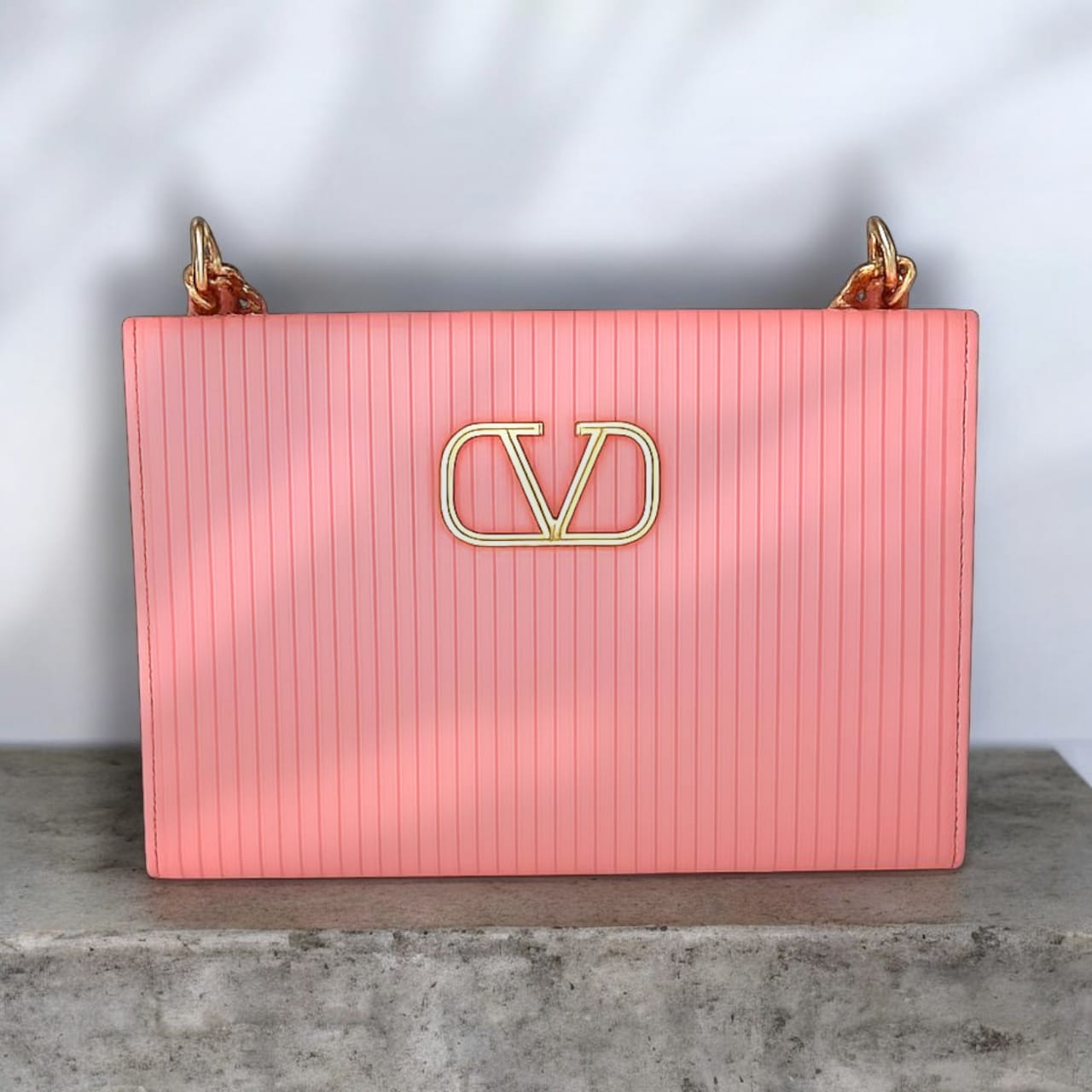 "Valentino Garavani Locò Shoulder Bag in Black with Gold-Tone Chain and Logo"